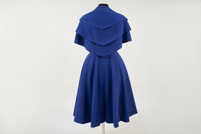 Image of Blue wool coat made in England and sold by John Doyle Bishop, 1951